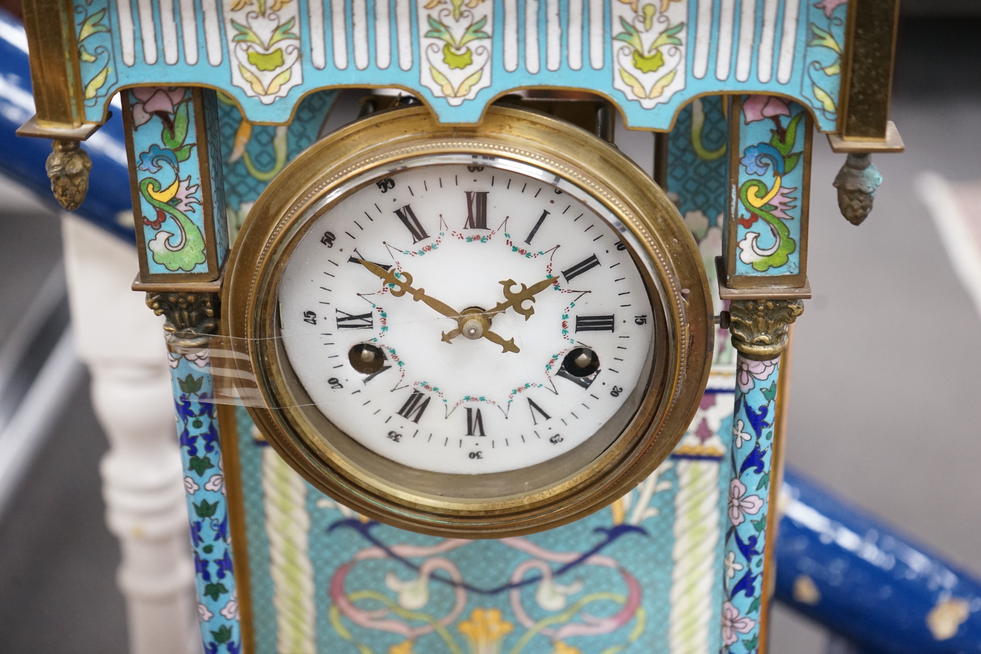 A large blue enamelled mantel clock with pendulum. 66cm tall